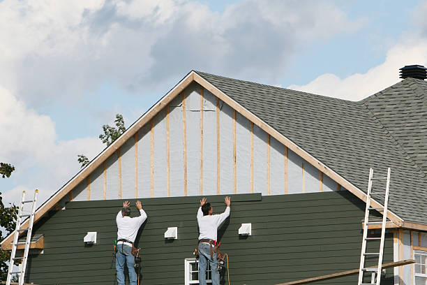 Professional Storm Damage Siding Repair technician working in Bucyrus, OH